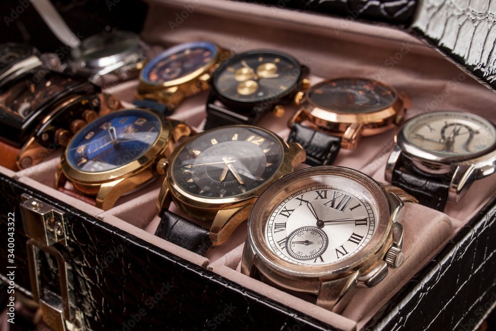 storage box with collection of men wrist watches